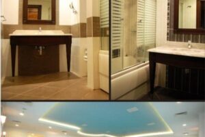 Nowoczesna łazienka z czarnymi umywalkami i prysznicem. - Metamar