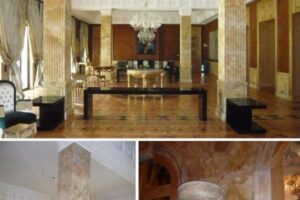 Luksusowy hall z marmurową podłogą, złotymi kolumnami i żyrandolem - Metamar