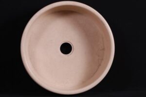 Beżowa ceramiczna umywalka okrągła z otworem, widok z góry - Metamar