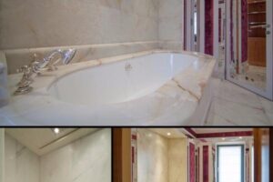 Elegancka łazienka z marmurową wanną i złotymi armaturami