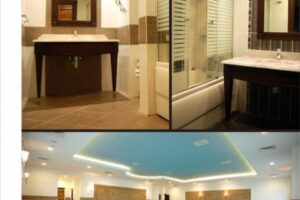 Łazienka z czarnymi meblami, kafelkami, lustrem i niebieskim sufitem - Metamar