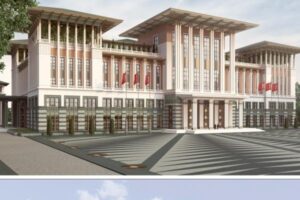 Nowoczesny budynek administracyjny z kolumnami i czerwoną cegłą - Metamar