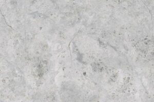 Szara betonowa powierzchnia z pęknięciami i zabrudzeniami - Metamar