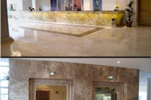 Lobby nowoczesnego budynku z marmurową podłogą i recepcją - Metamar